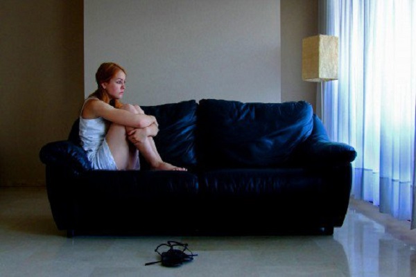 girl sitting alone in room 