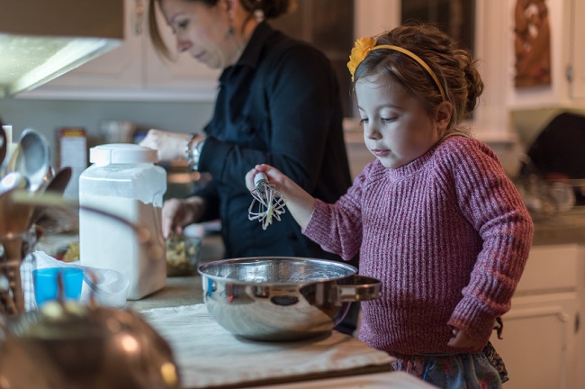 capricorn mother teaching kid cooking 