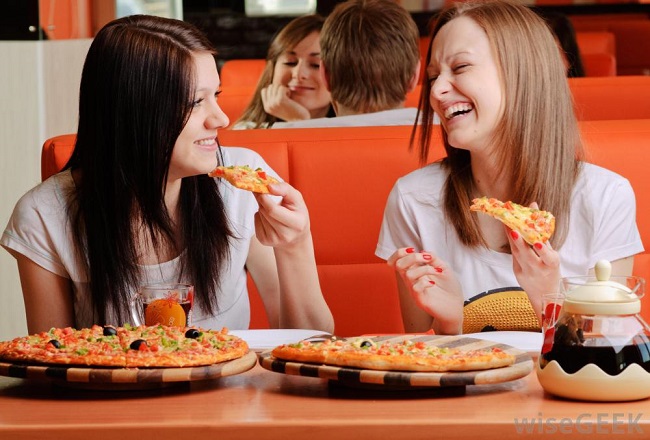 girls eating pizza