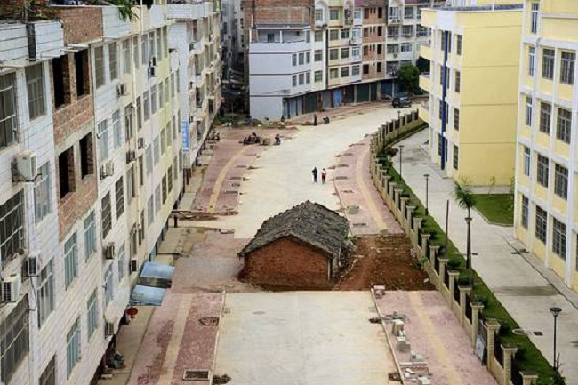 House in the middle of the road