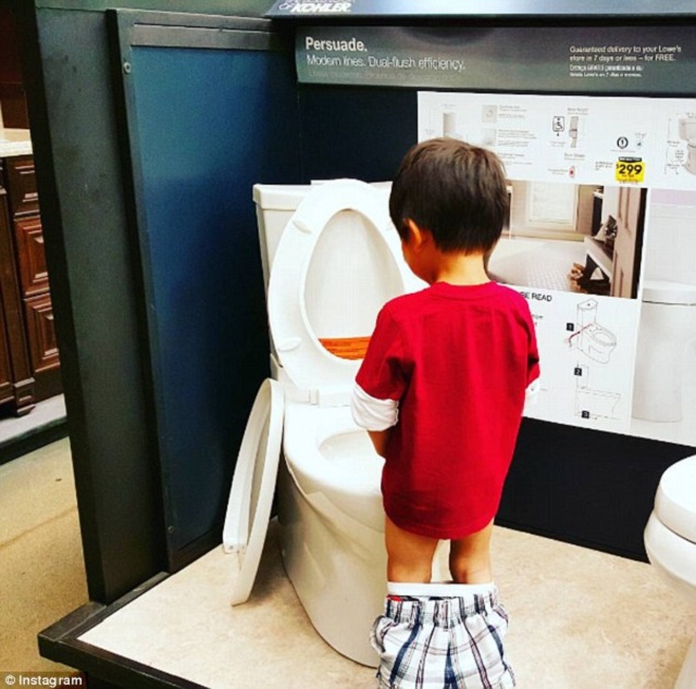 kid peeing in the display toilet