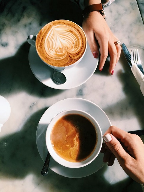 offering coffe to friend