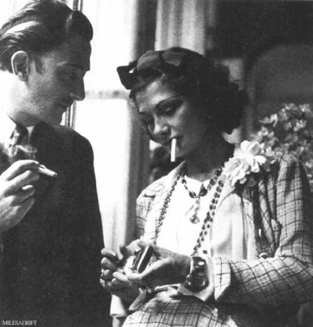 Salvador Dali offering smoke to coco