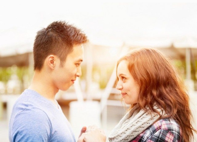 young couple looking into eachohters eyes