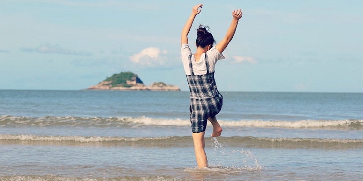 girl enjoying on the beach