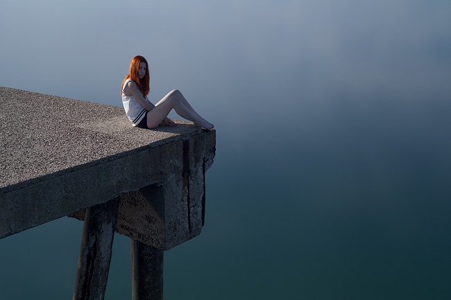 girl sitting alone