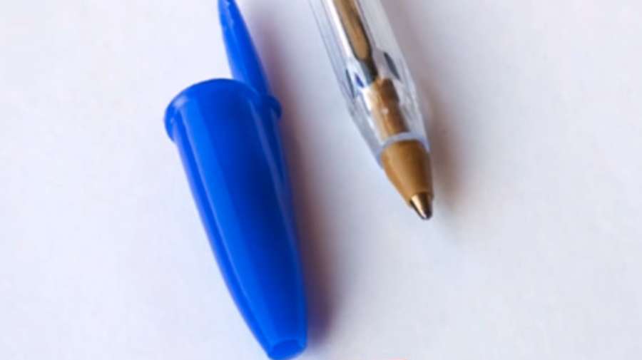 An opening in the highest point of a pen top.