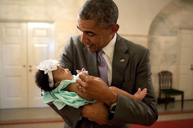 Obama Holding the Child of One of His Staff Members