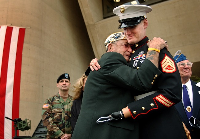 Pearl Harbor survivor embraces a fellow military man