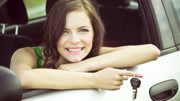 Girl holding car keys 