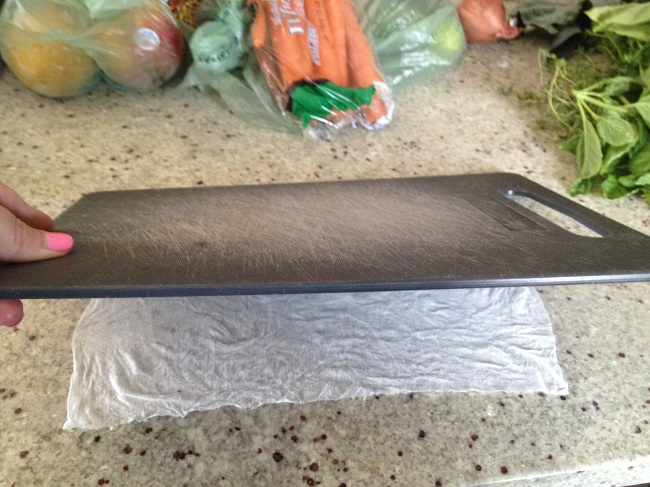 Placing chopping board on wet papper