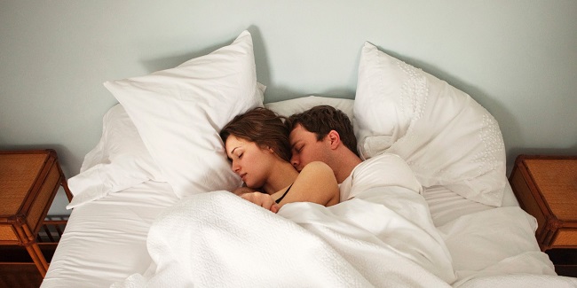 couples sleeping in the bed