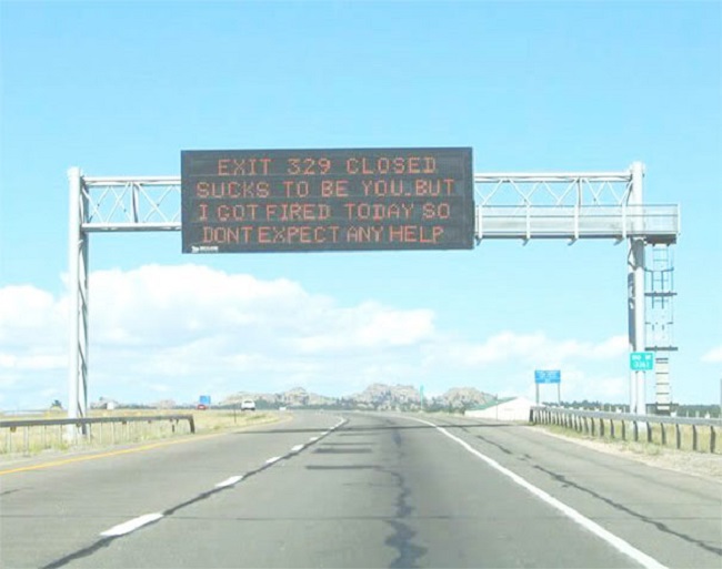 A sign on the road which said about quitting