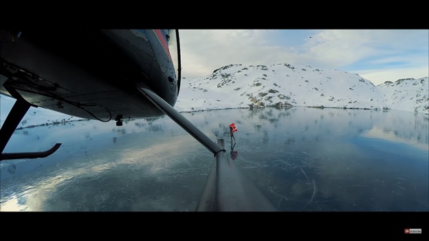 chopper landing on frozen lake 