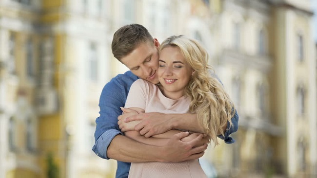 Woman loves hugs from behind