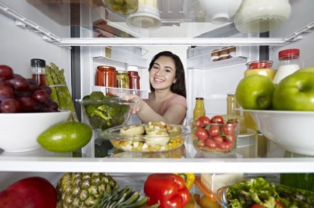 putting food in fridge