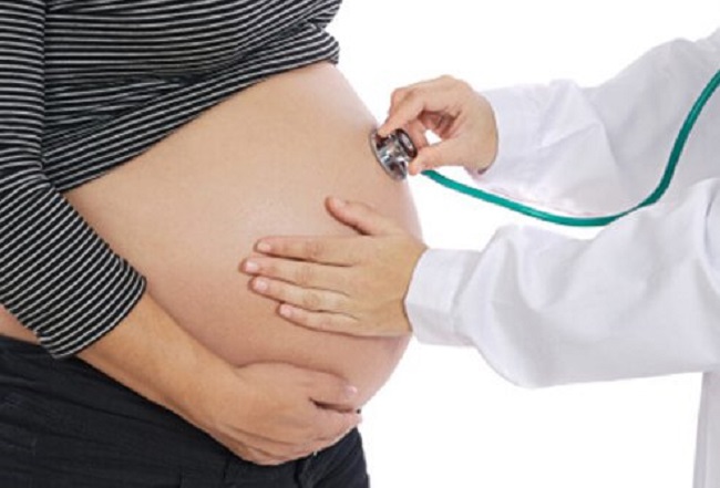 doctor checking pregnent girl 