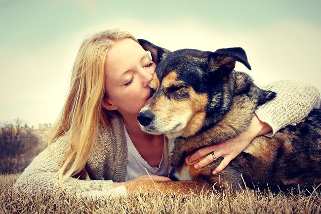 girl loving pet