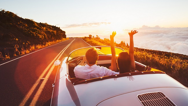 happy couple driving 