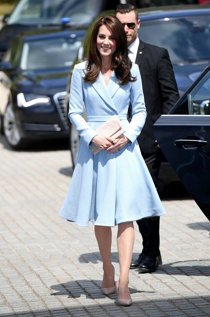 Kate looks impeccable in this princess-cut suit dress