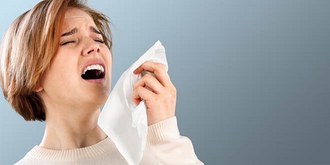 sneezing woman 