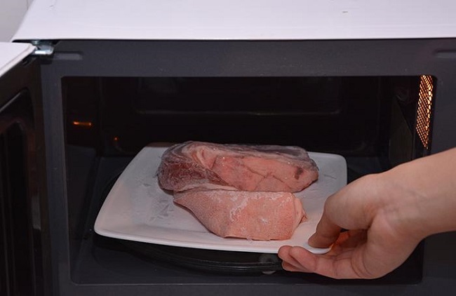 Frozen meat in microwave