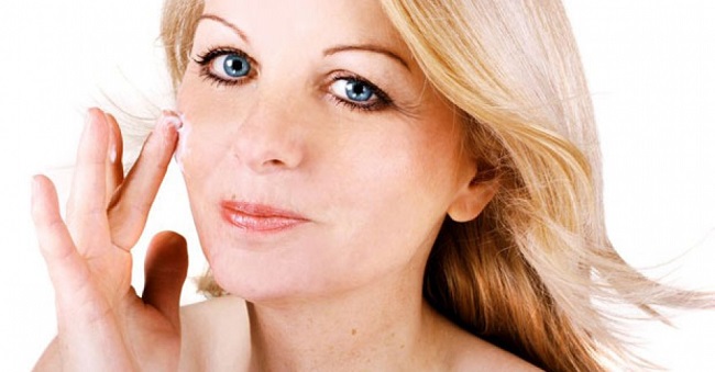 woman scrubbing face