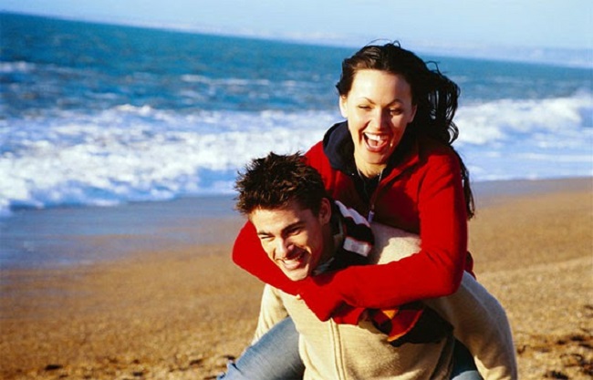 couple playing on the beach