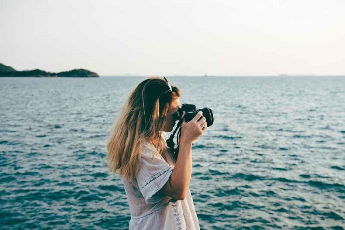 Girl capturing photo.