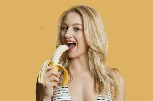 Girl eating banana