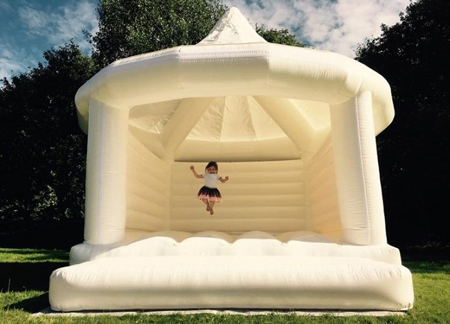 Girl jumping on castle