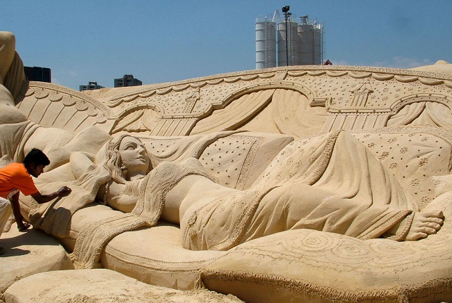 Indian woman sand art