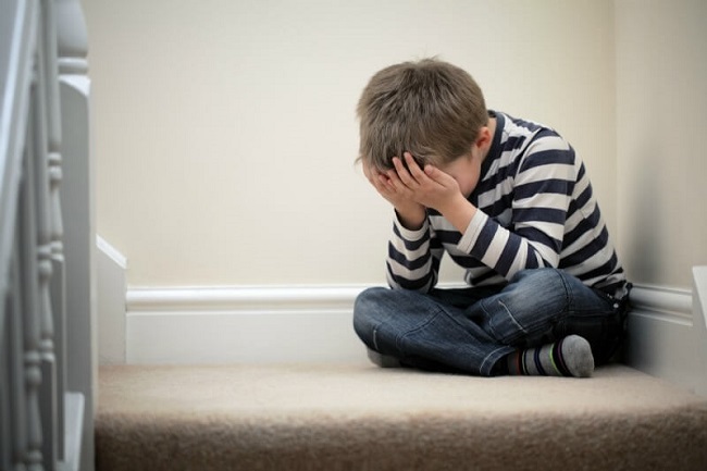 Kid sitting alone