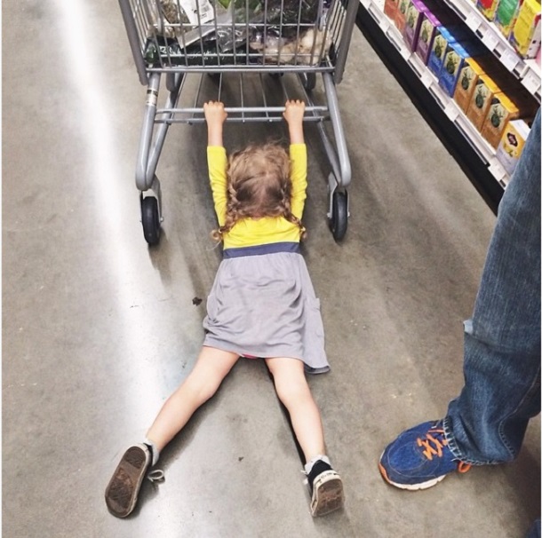 Kids holding shopping cart