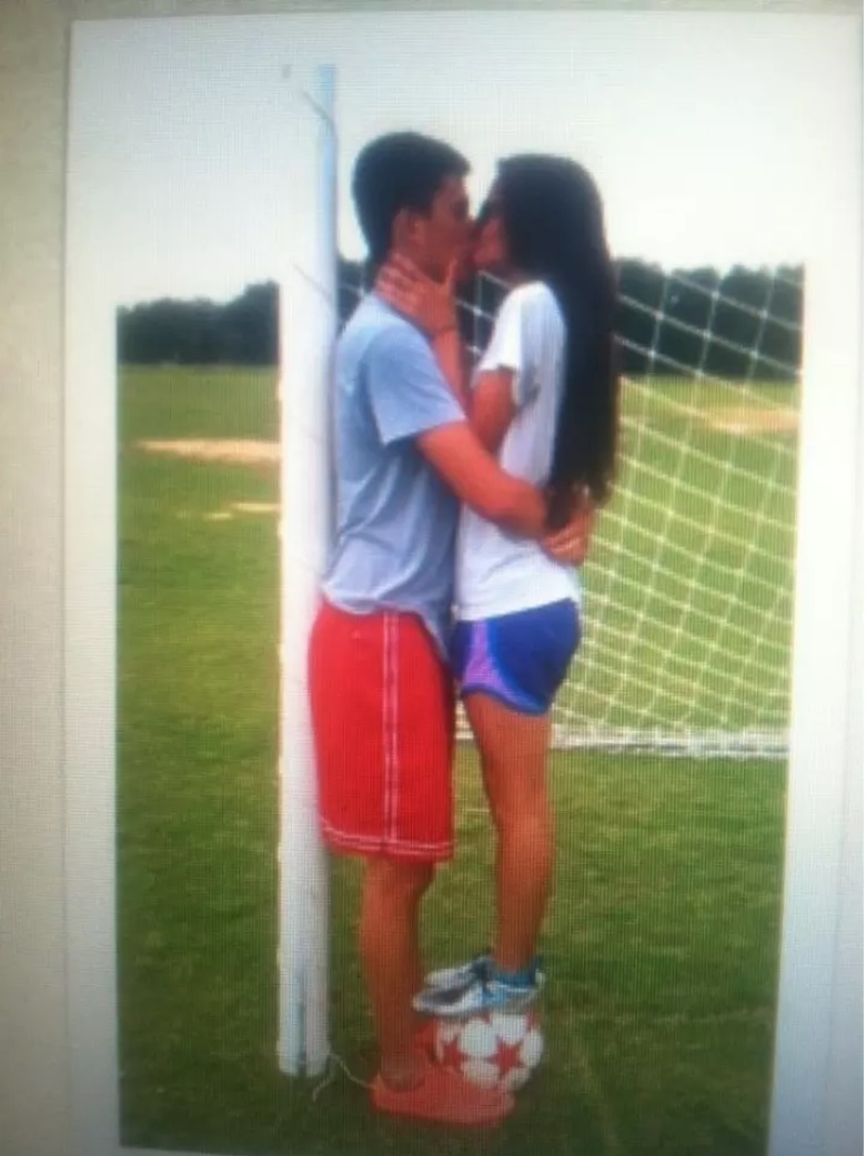 This soccer player kissing