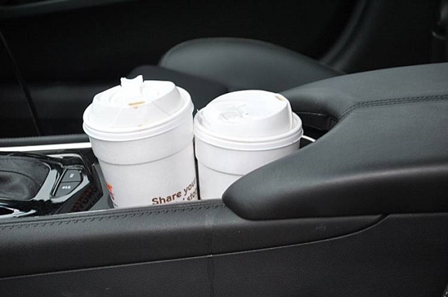 Two cups of coffee in the car